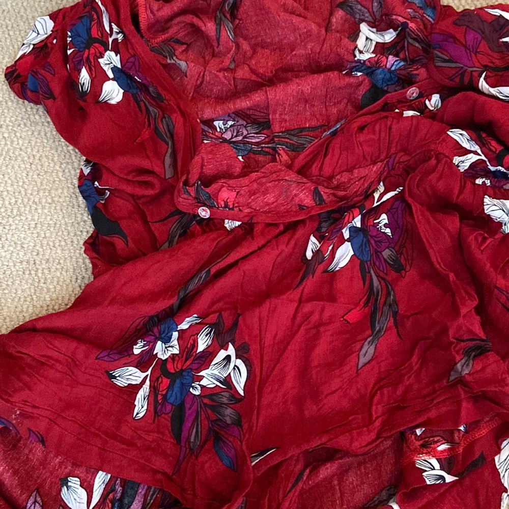 Red with blue and white flowers on it  a romper good for the summer